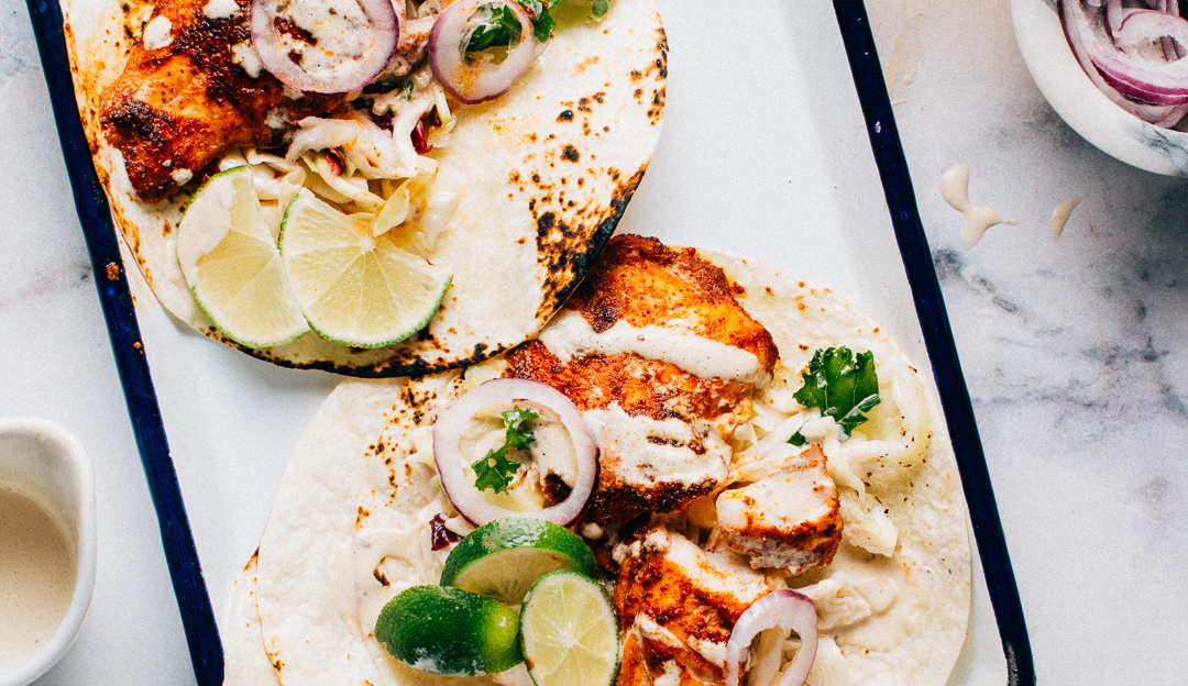 Grilled Spicy Fish Tacos with Cabbage Slaw and Lime Crema